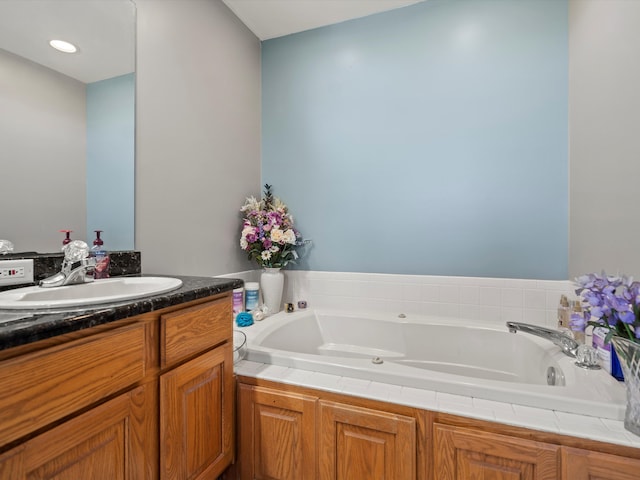 7111 Tucker Rd, Holly, MI 48442 - bathroom with a garden tub and vanity
