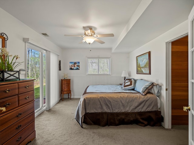 7111 Tucker Rd, Holly, MI 48442 - bedroom featuring light carpet, access to outside, multiple windows, and ceiling fan