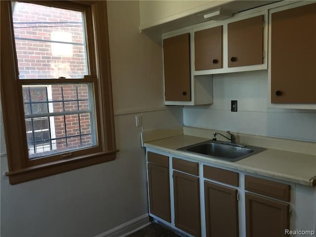 19394 Waltham St, Detroit, MI 48205 - kitchen featuring a sink, light countertops, and plenty of natural light