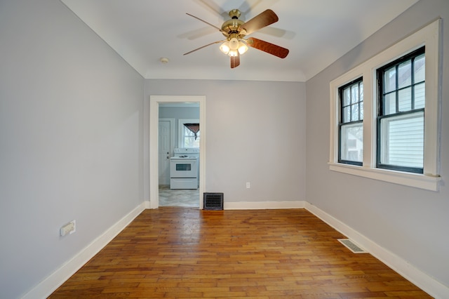 715 N St, Mount Morris, MI 48458 - spare room with healthy amount of natural light, a ceiling fan, and wood finished floors