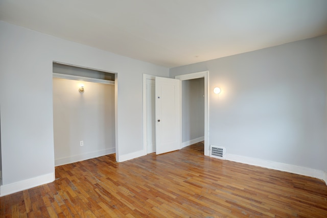 715 N St, Mount Morris, MI 48458 - unfurnished bedroom featuring light wood-style floors and baseboards