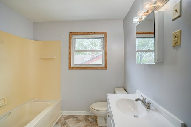 715 N St, Mount Morris, MI 48458 - bathroom with toilet, baseboards, and vanity