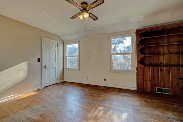 419 S State Rd, Davison, MI 48423 - unfurnished bedroom with wood-type flooring, vaulted ceiling, baseboards, and ceiling fan