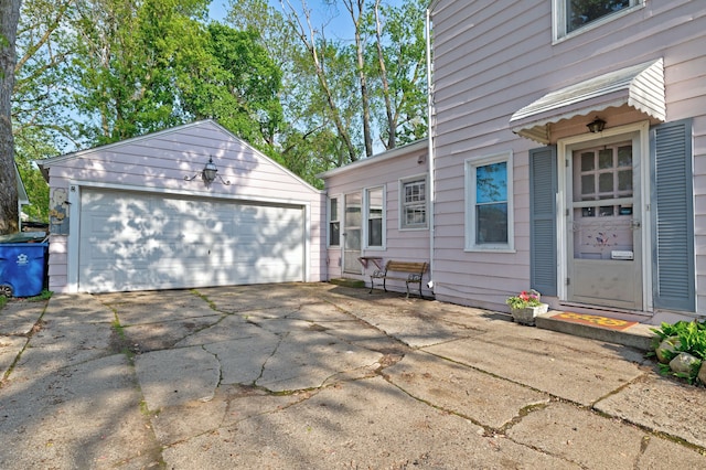 419 S State Rd, Davison, MI 48423 - view of property exterior with an outdoor structure and a detached garage
