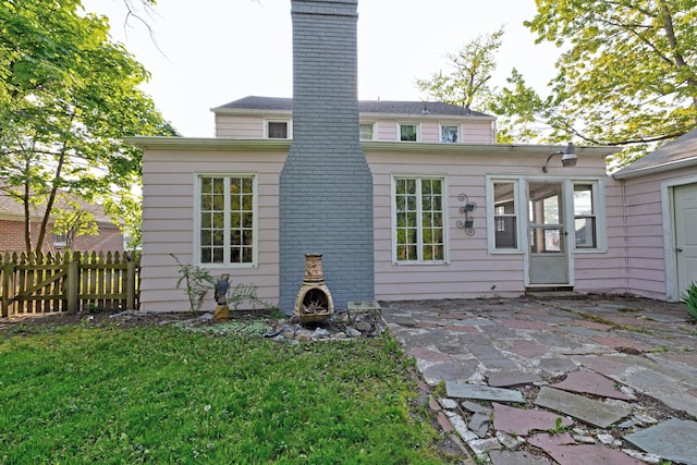 419 S State Rd, Davison, MI 48423 - back of house featuring a patio area and a chimney