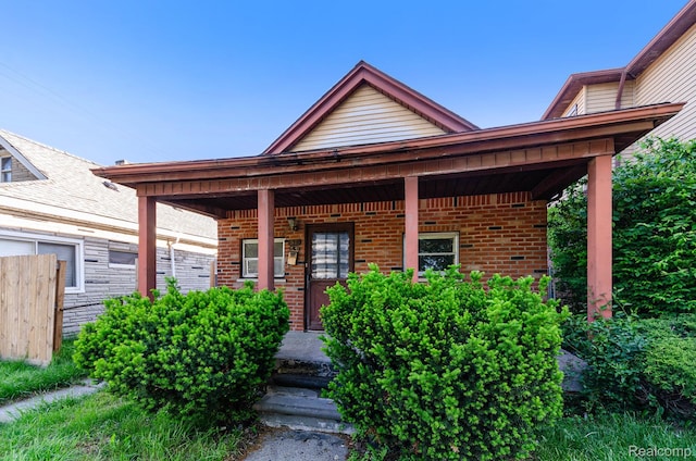 54 W Rockwood St, Ecorse, MI 48229 - property entrance featuring brick siding and covered porch