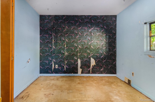 54 W Rockwood St, Ecorse, MI 48229 - spare room with an accent wall, baseboards, and wallpapered walls