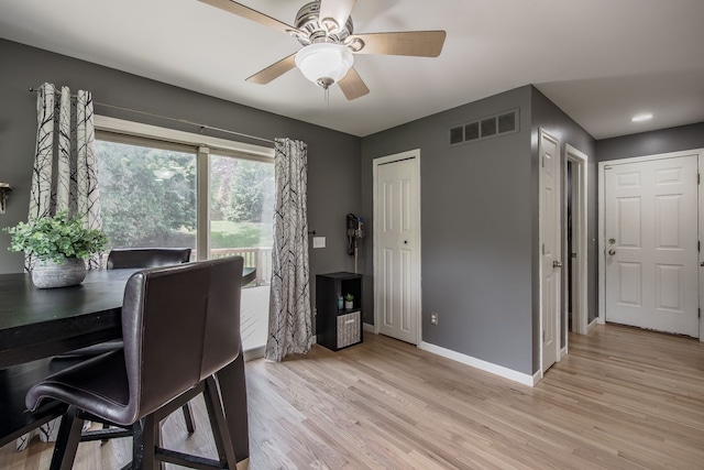 office with baseboards, light wood-style flooring, and ceiling fan