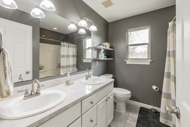 full bath featuring toilet, baseboards, tile patterned floors, double vanity, and a shower with curtain