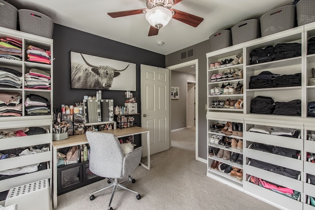 office area featuring carpet floors, ceiling fan, and baseboards