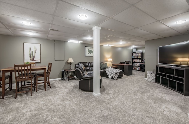 living area with carpet flooring and a drop ceiling