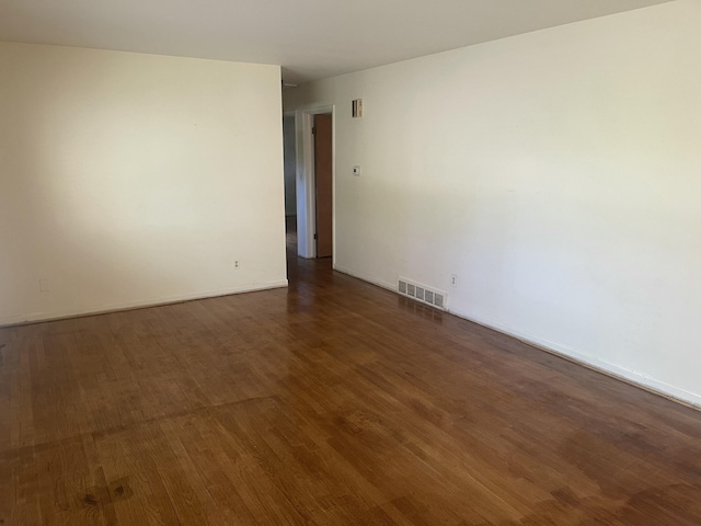 950 Raymond St, Ann Arbor, MI 48103 - spare room featuring dark wood-style floors and baseboards