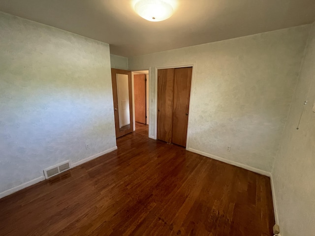 950 Raymond St, Ann Arbor, MI 48103 - unfurnished bedroom featuring wood finished floors, baseboards, and a closet