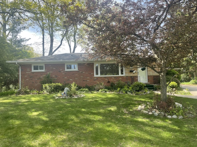950 Raymond St, Ann Arbor, MI 48103 - view of front of property with brick siding and a front yard