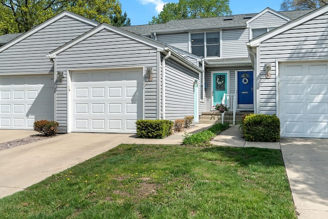 363 Vester St, Ferndale, MI 48220 - view of front of property featuring concrete driveway, an attached garage, a front yard, and a shingled roof
