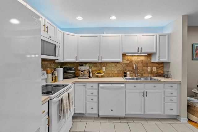 363 Vester St, Ferndale, MI 48220 - kitchen with white appliances, a sink, light countertops, white cabinetry, and recessed lighting
