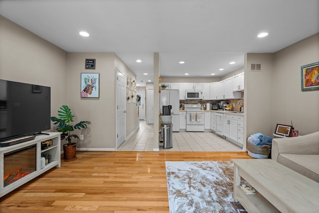 363 Vester St, Ferndale, MI 48220 - living room with light wood-type flooring, baseboards, and recessed lighting