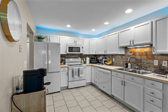 363 Vester St, Ferndale, MI 48220 - kitchen with white appliances, a sink, decorative backsplash, white cabinets, and recessed lighting