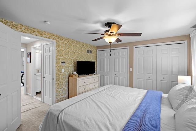 363 Vester St, Ferndale, MI 48220 - carpeted bedroom with wallpapered walls, multiple closets, ceiling fan, and baseboards