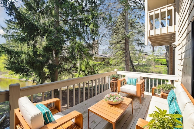 wooden deck featuring a water view