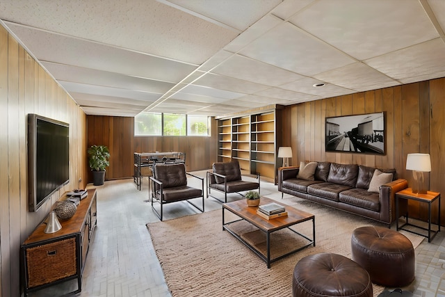 living area with wood walls and light wood-type flooring