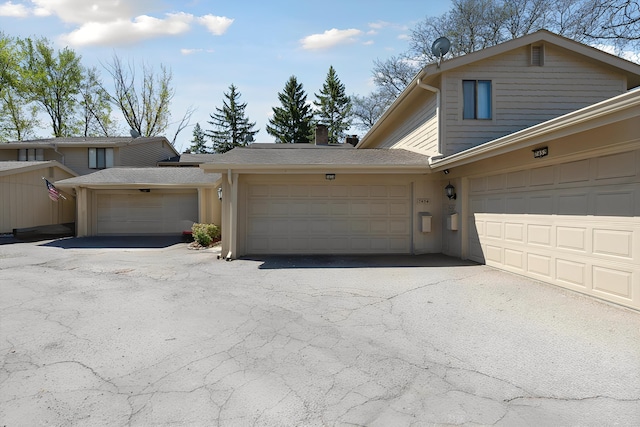 view of front of property with a garage and driveway