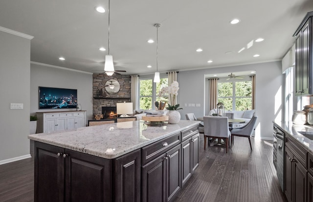 50279 Cromwell St, Canton, MI 48188 - kitchen featuring ceiling fan, crown molding, a stone fireplace, recessed lighting, and baseboards