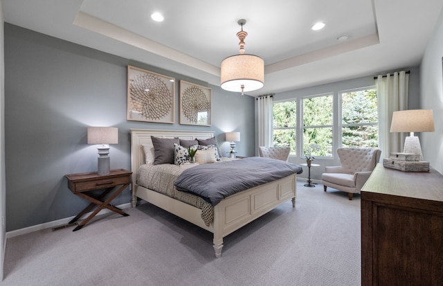 50279 Cromwell St, Canton, MI 48188 - bedroom featuring a tray ceiling, light colored carpet, recessed lighting, and baseboards