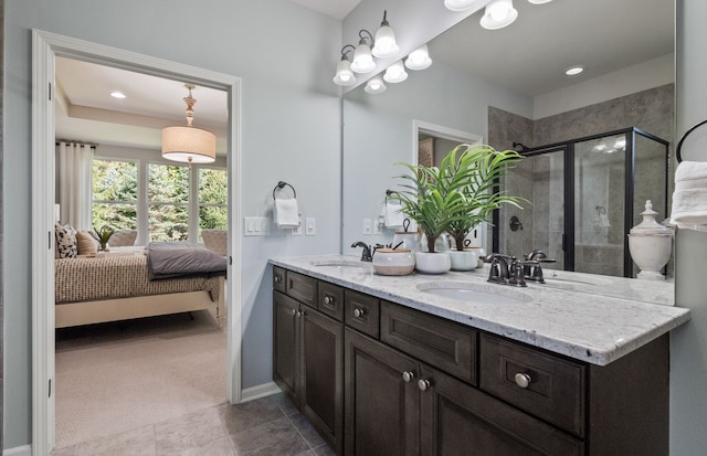 50279 Cromwell St, Canton, MI 48188 - ensuite bathroom featuring a stall shower, baseboards, and double vanity