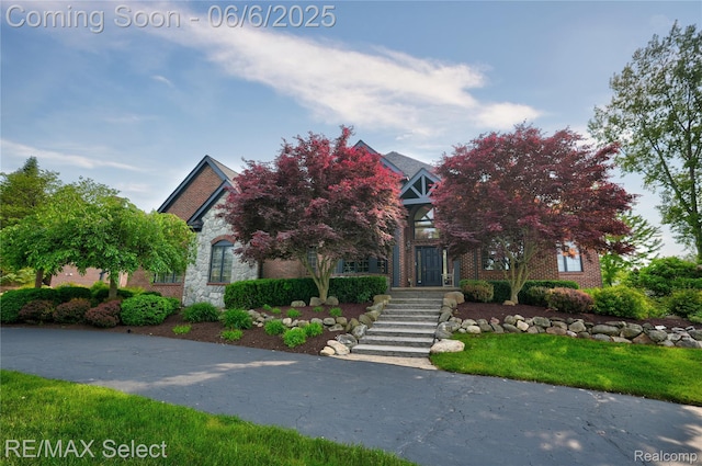 8320 Misty Mdws, Grand Blanc, MI 48439 - obstructed view of property with stone siding and brick siding