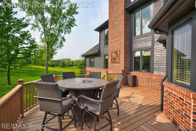 8320 Misty Mdws, Grand Blanc, MI 48439 - wooden deck with outdoor dining area and a lawn