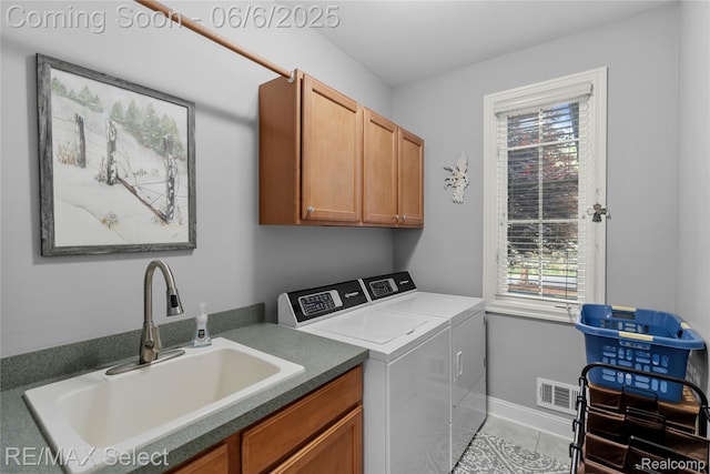 8320 Misty Mdws, Grand Blanc, MI 48439 - laundry area featuring washer and clothes dryer, cabinet space, healthy amount of natural light, and tile patterned floors