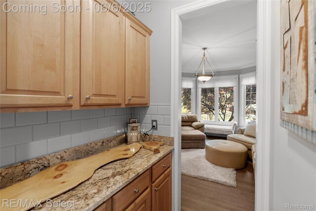 8320 Misty Mdws, Grand Blanc, MI 48439 - bathroom with wood finished floors, tasteful backsplash, crown molding, and vanity