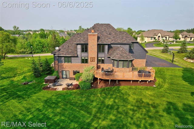 8320 Misty Mdws, Grand Blanc, MI 48439 - rear view of property featuring a chimney, a wooden deck, brick siding, a patio, and a lawn