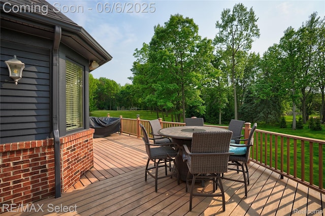 8320 Misty Mdws, Grand Blanc, MI 48439 - deck with outdoor dining space, a yard, and view of scattered trees