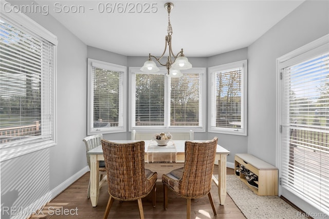 8320 Misty Mdws, Grand Blanc, MI 48439 - dining area featuring wood finished floors, baseboards, and a chandelier