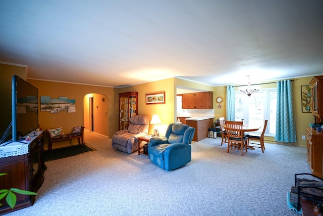 1090 Sunset Dr, Holly, MI 48442 - living room with arched walkways, carpet flooring, a chandelier, and crown molding
