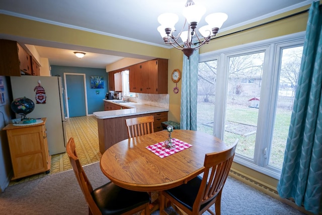 1090 Sunset Dr, Holly, MI 48442 - dining area with a chandelier and ornamental molding