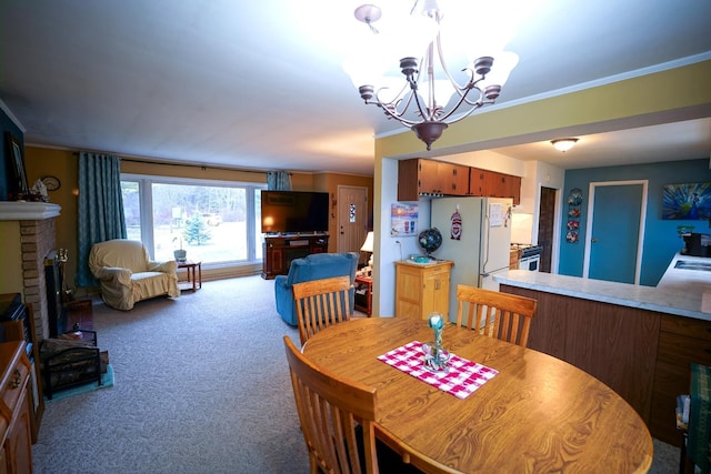 1090 Sunset Dr, Holly, MI 48442 - dining space with carpet flooring, a chandelier, crown molding, and a fireplace