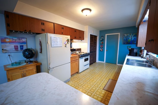 1090 Sunset Dr, Holly, MI 48442 - kitchen with white appliances, a sink, light flooring, and light countertops