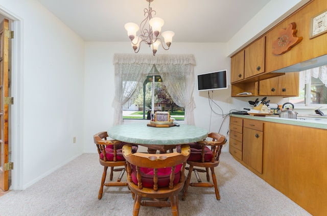 3683 Elmwood, Vassar, MI 48768 - dining room featuring light colored carpet and a chandelier