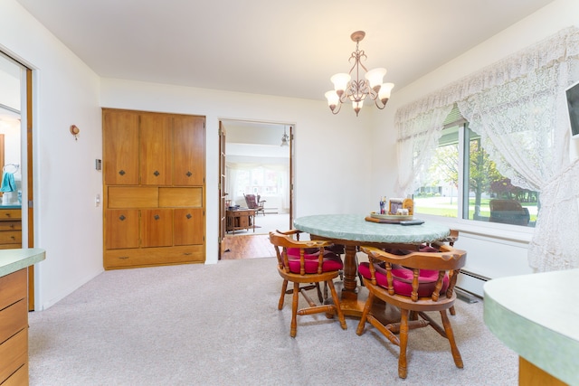 3683 Elmwood, Vassar, MI 48768 - dining space featuring a chandelier and light carpet