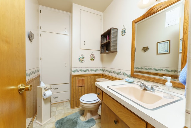 3683 Elmwood, Vassar, MI 48768 - bathroom with wainscoting, toilet, and vanity