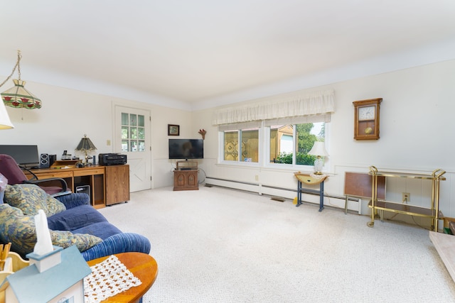 3683 Elmwood, Vassar, MI 48768 - carpeted living room with healthy amount of natural light, baseboard heating, and a desk