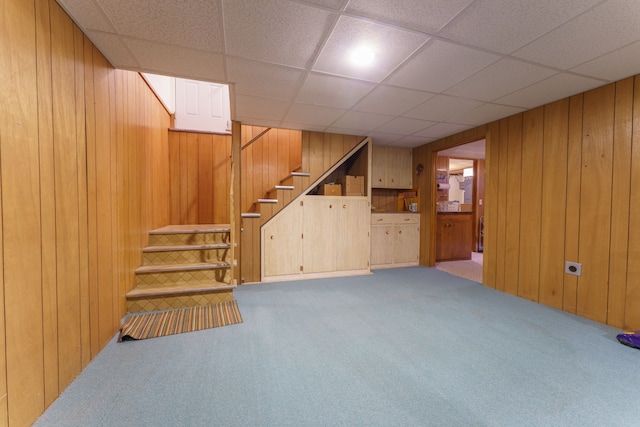 3683 Elmwood, Vassar, MI 48768 - finished basement with carpet flooring, wooden walls, and stairway