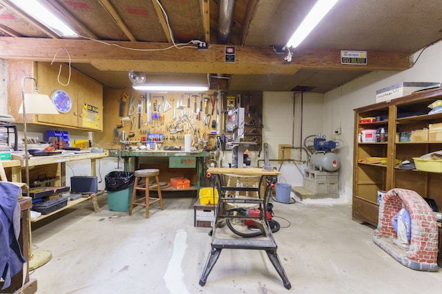 3683 Elmwood, Vassar, MI 48768 - unfinished basement featuring a workshop area