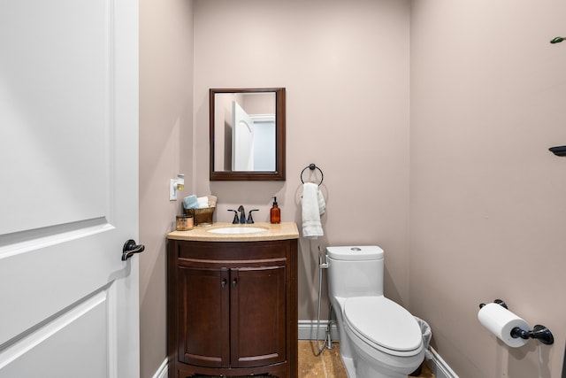 25031 Newton St, Dearborn, MI 48124 - bathroom with toilet, vanity, and baseboards
