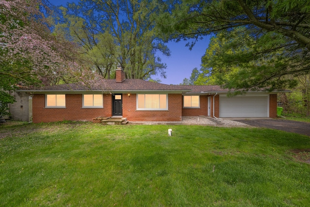1090 S Williams Lake Rd, White Lake, MI 48386 - ranch-style house with a garage, driveway, a chimney, a front yard, and brick siding