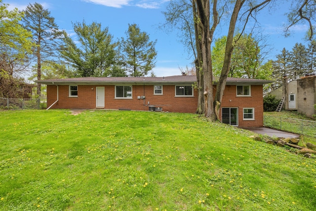 1090 S Williams Lake Rd, White Lake, MI 48386 - back of property featuring brick siding, a patio, and central air condition unit
