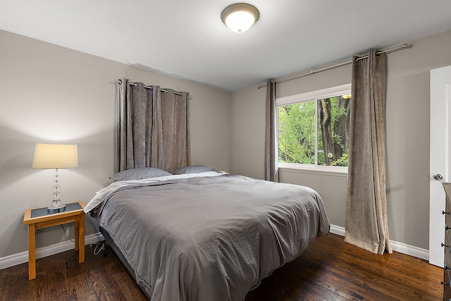 1090 S Williams Lake Rd, White Lake, MI 48386 - bedroom featuring baseboards and wood finished floors